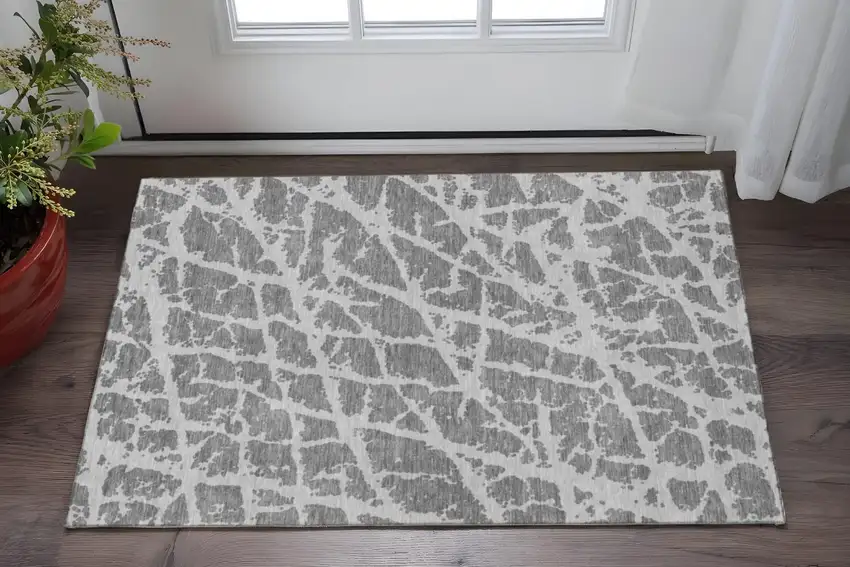 Charcoal And Ivory Abstract Washable Area Rug With UV Protection Photo 2