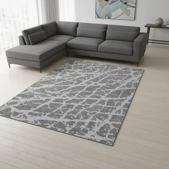 Charcoal And Ivory Abstract Washable Area Rug With UV Protection Photo 1