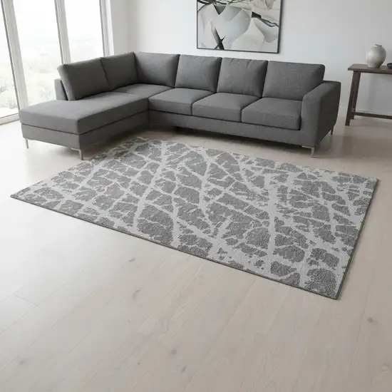 Charcoal And Ivory Abstract Washable Area Rug With UV Protection Photo 1
