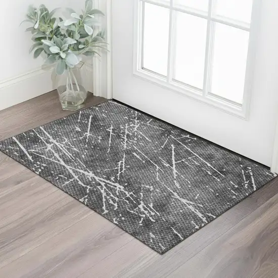 Charcoal And Ivory Abstract Washable Area Rug With UV Protection Photo 1