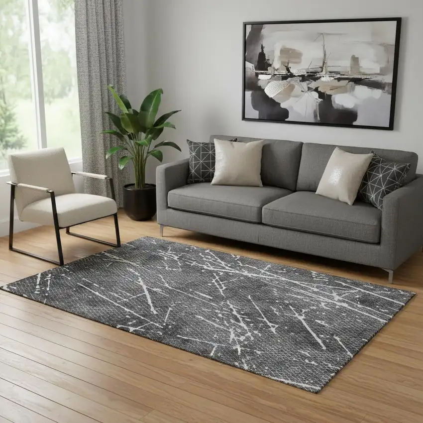 Charcoal And Ivory Abstract Washable Area Rug With UV Protection Photo 1