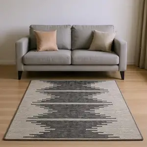 Photo of Charcoal And Ivory Abstract Washable Area Rug With UV Protection