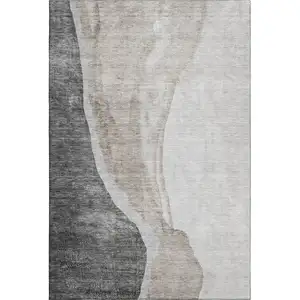 Photo of Charcoal And Ivory Abstract Washable Area Rug With UV Protection