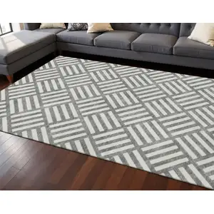 Photo of Charcoal And Ivory Geometric Washable Area Rug With UV Protection