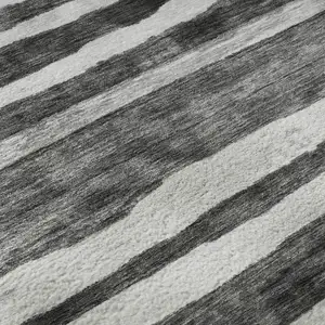 Photo of Charcoal And Ivory Striped Washable Area Rug With UV Protection