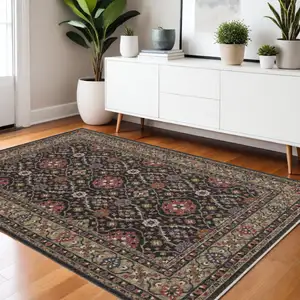 Photo of Charcoal And Pink Oriental Area Rug With Fringe