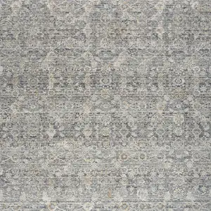 Photo of Charcoal Brown And Ivory Floral Distressed Area Rug With Fringe