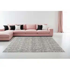 Photo of Charcoal Brown And Ivory Floral Distressed Area Rug With Fringe