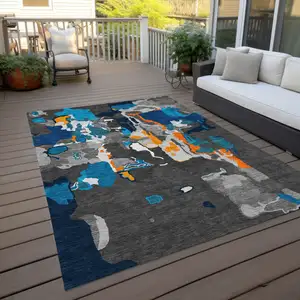 Photo of Charcoal Copper And Teal Blue Abstract Washable Indoor Outdoor Area Rug