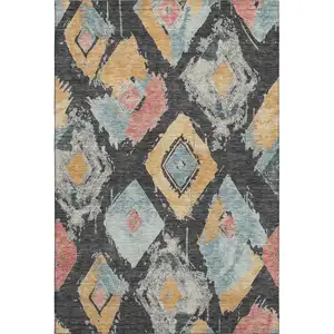 Photo of Charcoal Gold And Coral Abstract Geometric Washable Area Rug With UV Protection
