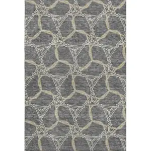 Photo of Charcoal Gold And Ivory Geometric Washable Area Rug With UV Protection