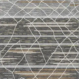 Photo of Charcoal Gray And Brown Striped Washable Area Rug With UV Protection