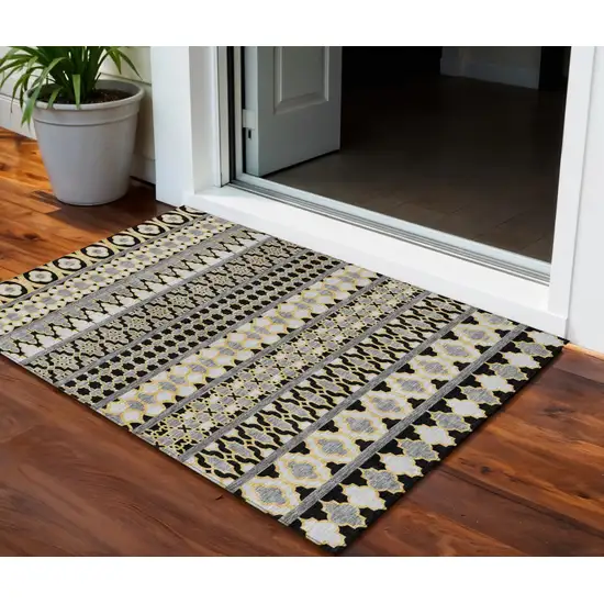 Charcoal Gray And Gold Quatrefoil Washable Indoor Outdoor Area Rug Photo 1