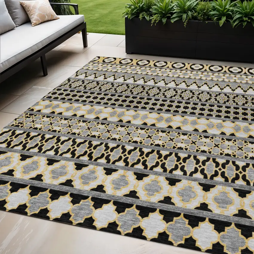 Charcoal Gray And Gold Quatrefoil Washable Indoor Outdoor Area Rug Photo 1