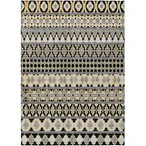 Photo of Charcoal Gray And Gold Quatrefoil Washable Indoor Outdoor Area Rug