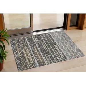 Photo of Charcoal Gray And Ivory Striped Washable Indoor Outdoor Area Rug