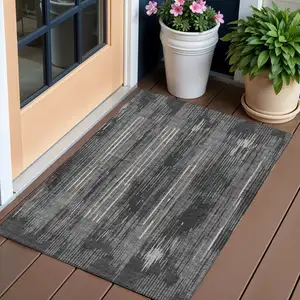Photo of Charcoal Gray And Ivory Striped Washable Indoor Outdoor Area Rug