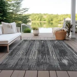 Photo of Charcoal Gray And Ivory Striped Washable Indoor Outdoor Area Rug