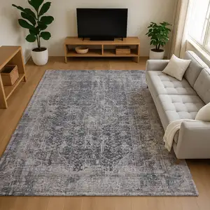 Photo of Charcoal Gray And Silver Floral Medallion Washable Area Rug With UV Protection