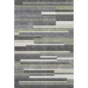 Photo of Charcoal Gray And Silver Striped Washable Area Rug With UV Protection