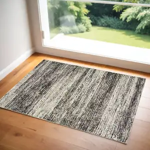 Photo of Charcoal Grey Silver And Ivory Abstract Power Loom Stain Resistant Area Rug
