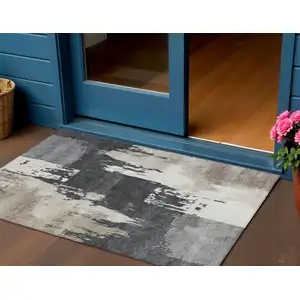 Photo of Charcoal Ivory And Beige Abstract Washable Indoor Outdoor Area Rug