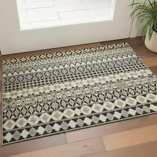 Charcoal Ivory And Copper Ikat Washable Area Rug With UV Protection Photo 2