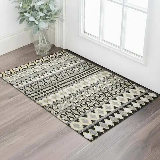 Charcoal Ivory And Copper Ikat Washable Area Rug With UV Protection Photo 1
