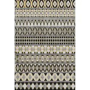 Photo of Charcoal Ivory And Copper Ikat Washable Area Rug With UV Protection