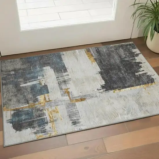 Charcoal Ivory And Gold Abstract Washable Area Rug With UV Protection Photo 1