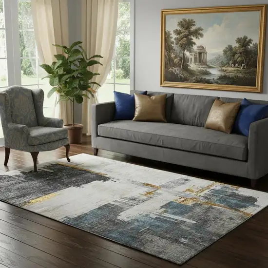 Charcoal Ivory And Gold Abstract Washable Area Rug With UV Protection Photo 1