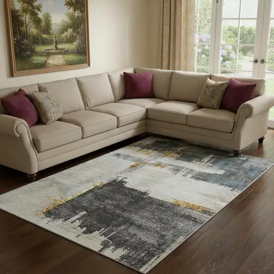 Charcoal Ivory And Gold Abstract Washable Area Rug With UV Protection Photo 1