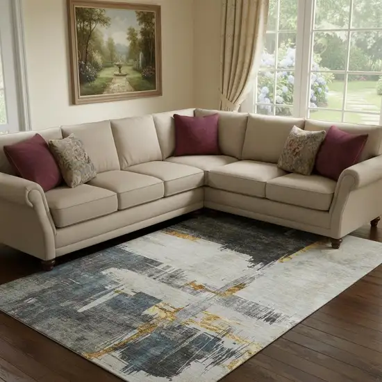 Charcoal Ivory And Gold Abstract Washable Area Rug With UV Protection Photo 1