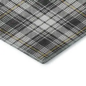 Photo of Charcoal Ivory And Gold Plaid Washable Area Rug With UV Protection