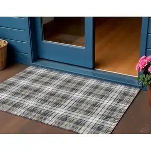 Photo of Charcoal Ivory And Gold Plaid Washable Indoor Outdoor Area Rug
