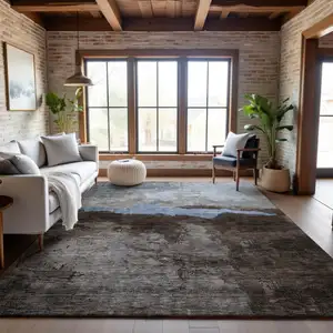 Photo of Chocolate And Blue Abstract Washable Area Rug With UV Protection