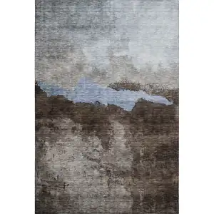 Photo of Chocolate And Blue Abstract Washable Area Rug With UV Protection