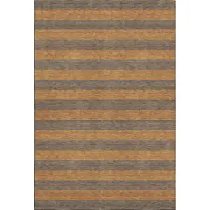 Photo of Chocolate And Copper Striped Washable Area Rug With UV Protection