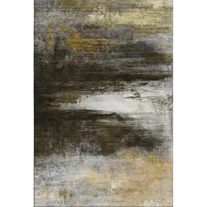 Photo of Chocolate And Gold Abstract Washable Area Rug With UV Protection