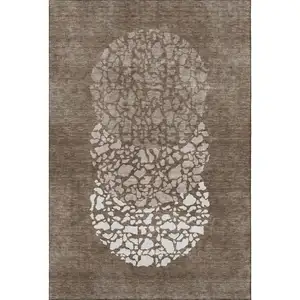Photo of Chocolate And Ivory Abstract Washable Area Rug With UV Protection