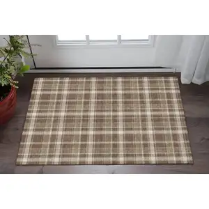 Photo of Chocolate And Ivory Plaid Washable Area Rug With UV Protection