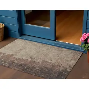 Photo of Chocolate And Taupe Abstract Washable Indoor Outdoor Area Rug