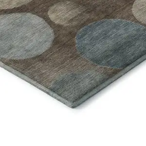 Photo of Chocolate And Teal Geometric Washable Area Rug With UV Protection