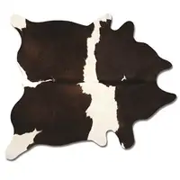Photo of Chocolate And White Cowhide - Area Rug