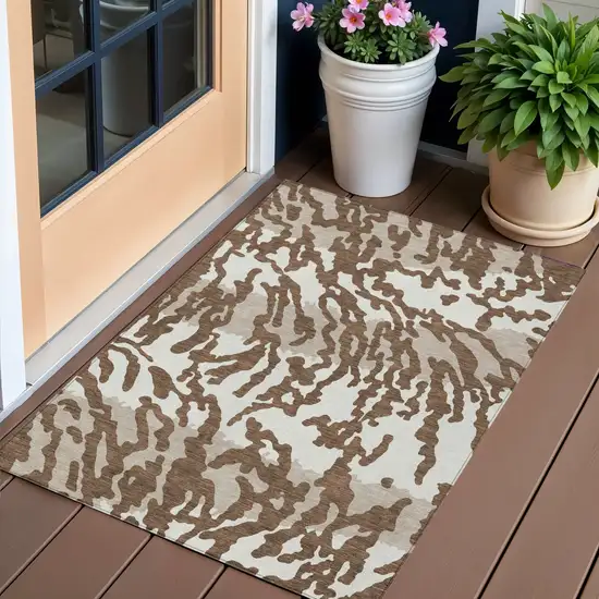 Chocolate Beige And Ivory Animal Print Washable Indoor Outdoor Area Rug Photo 1