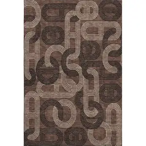 Photo of Chocolate Black And Beige Geometric Washable Area Rug With UV Protection