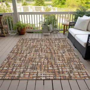 Photo of Chocolate Copper And Beige Abstract Washable Indoor Outdoor Area Rug