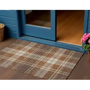 Photo of Chocolate Copper And Gold Plaid Washable Indoor Outdoor Area Rug