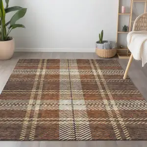 Photo of Chocolate Copper And Gold Plaid Washable Indoor Outdoor Area Rug