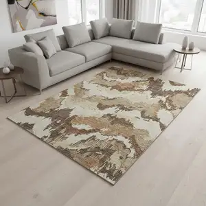 Photo of Chocolate Ivory And Beige Abstract Washable Area Rug With UV Protection
